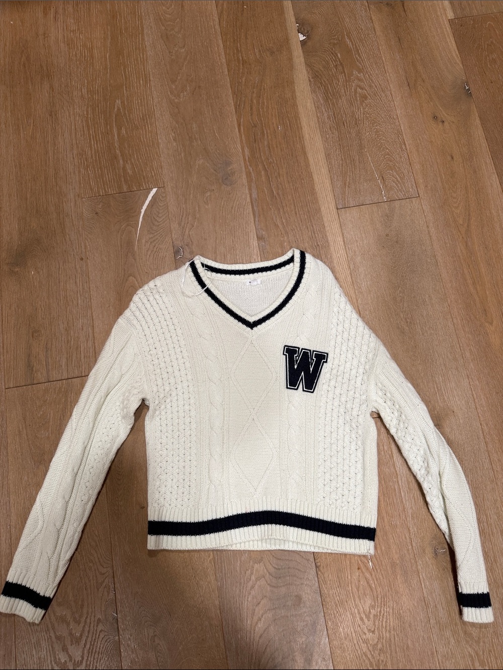 Garage Cream Cable-Knit V-Neck Sweater with Black Trim and 'W' Patch